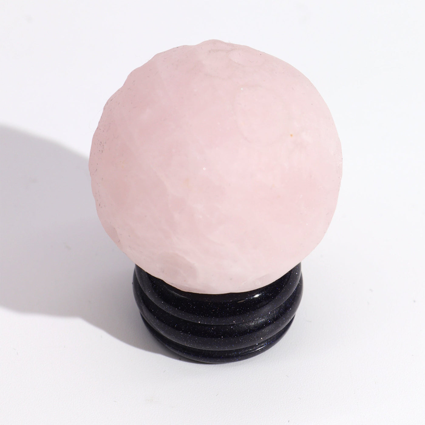 Rose Quartz Venus Planet Ornament Decoration On A Sola Stand.